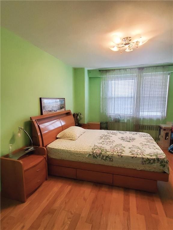 bedroom with wood finished floors