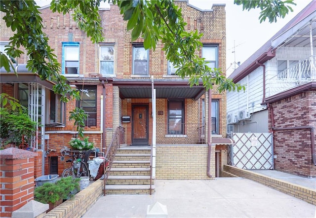 view of property featuring brick siding