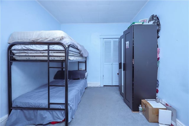 bedroom featuring carpet, crown molding, and baseboards