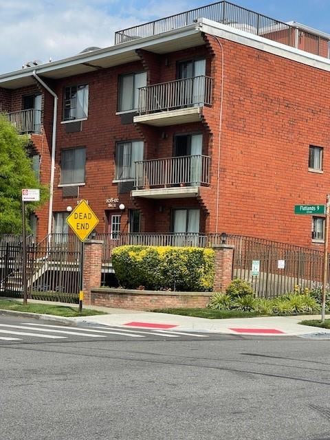 view of property with fence