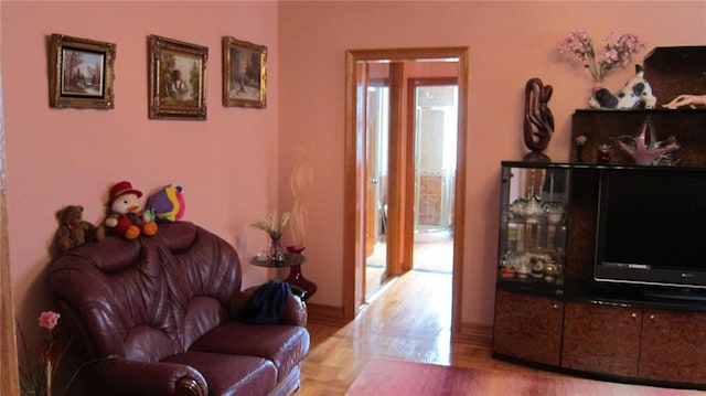 living room featuring a healthy amount of sunlight and light wood-style flooring