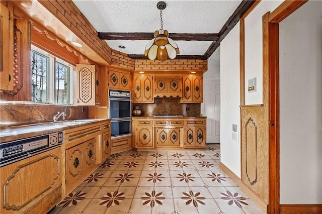 kitchen with beam ceiling, decorative light fixtures, gas stovetop, double wall oven, and a textured ceiling