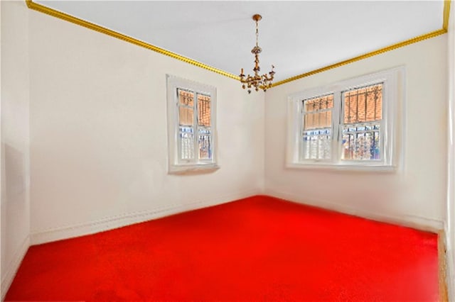 empty room featuring an inviting chandelier