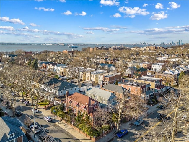 birds eye view of property featuring a residential view and a water view