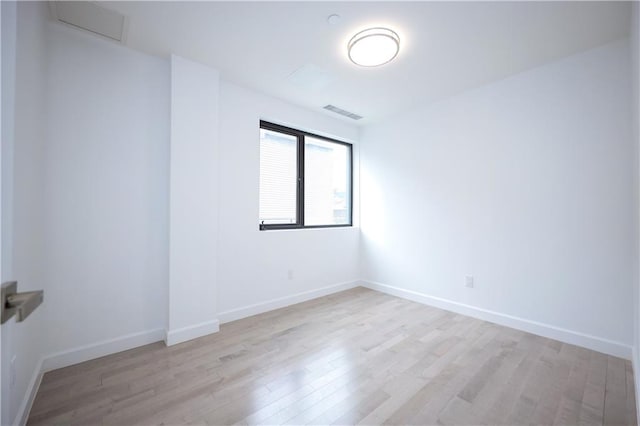 unfurnished room featuring light hardwood / wood-style flooring