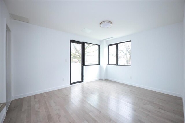 empty room with light wood-type flooring