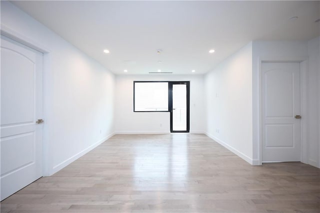 empty room with light wood-type flooring