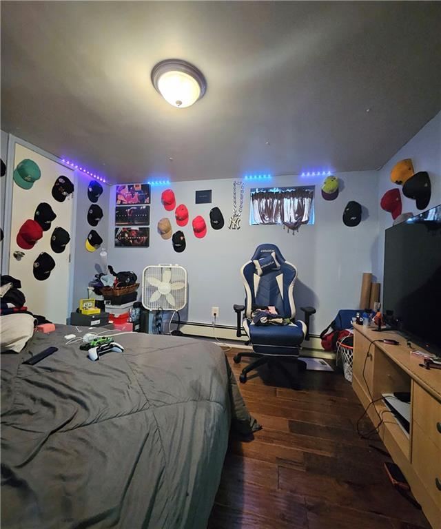 bedroom with wood finished floors