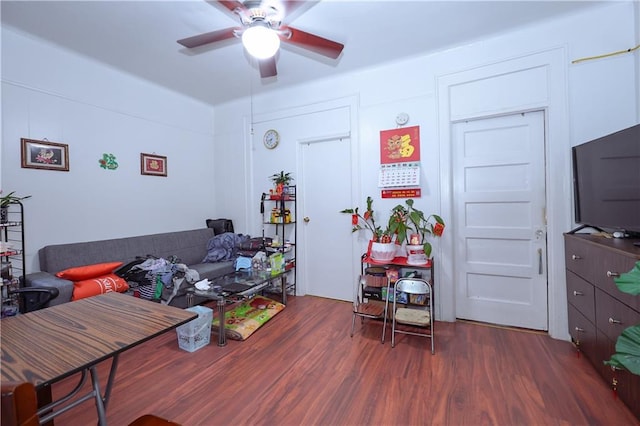 interior space with ceiling fan and dark hardwood / wood-style flooring