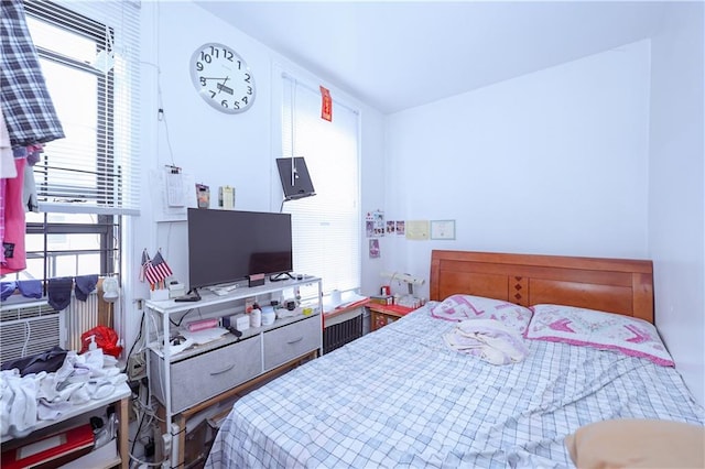 bedroom featuring multiple windows