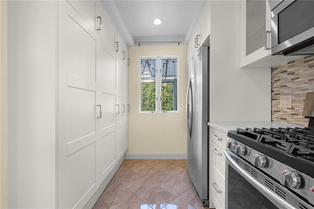 kitchen with stainless steel appliances, baseboards, white cabinets, backsplash, and glass insert cabinets