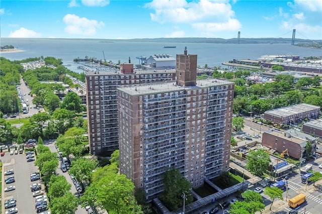 drone / aerial view featuring a view of city and a water view