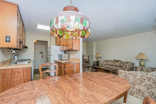 dining space featuring a skylight