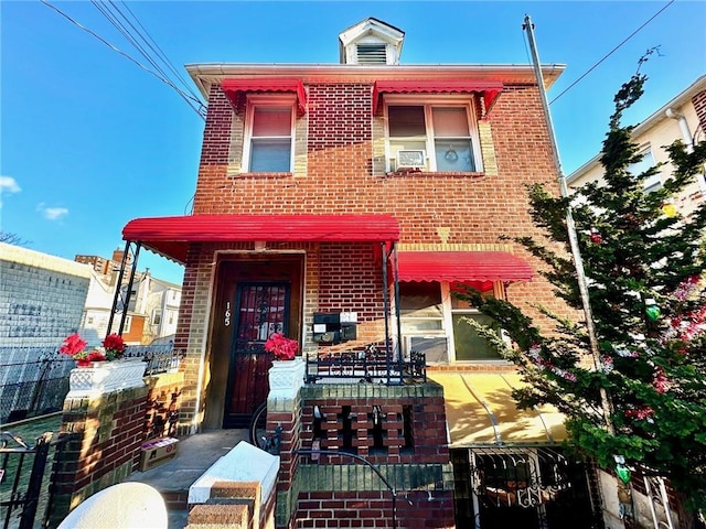 view of front of property featuring brick siding