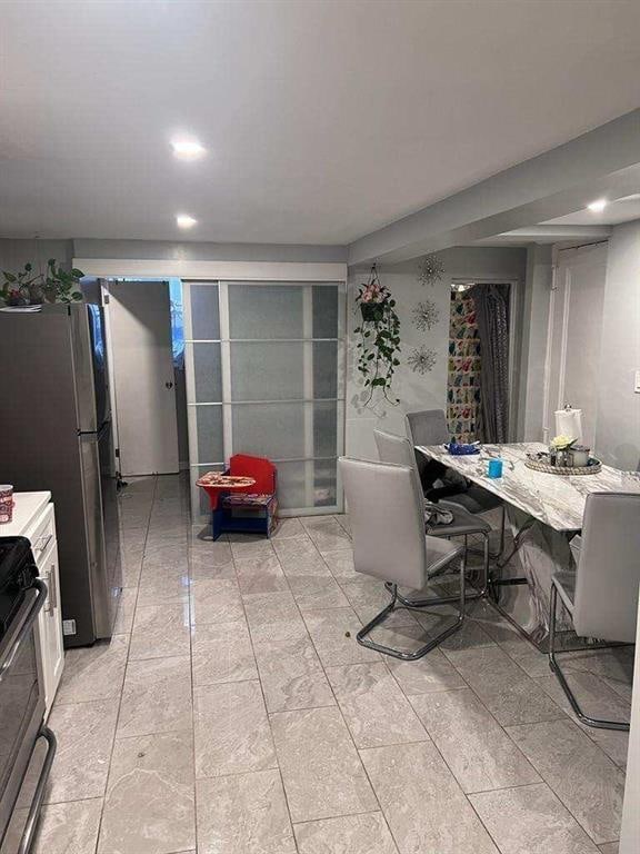 dining area featuring recessed lighting