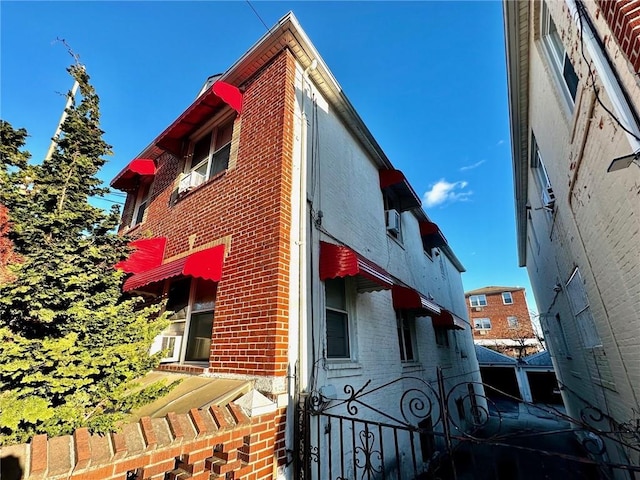 view of home's exterior featuring brick siding