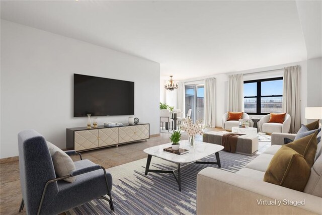 living room featuring a notable chandelier