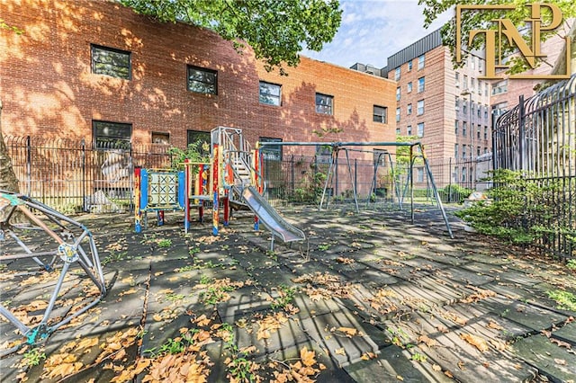 communal playground featuring fence
