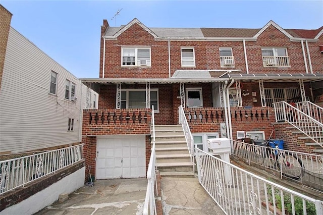 townhome / multi-family property featuring a garage