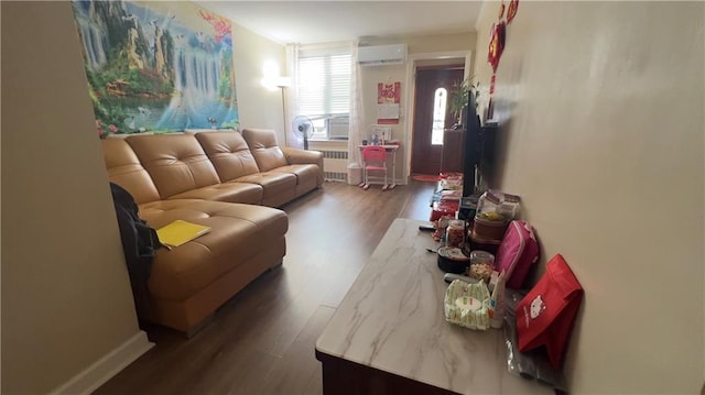 living room with a wall mounted AC, radiator heating unit, and dark hardwood / wood-style flooring