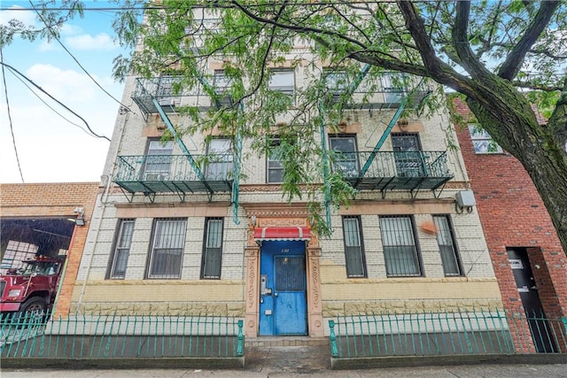 view of front of property with a balcony