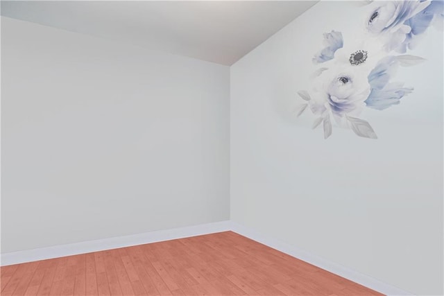 unfurnished room featuring hardwood / wood-style floors