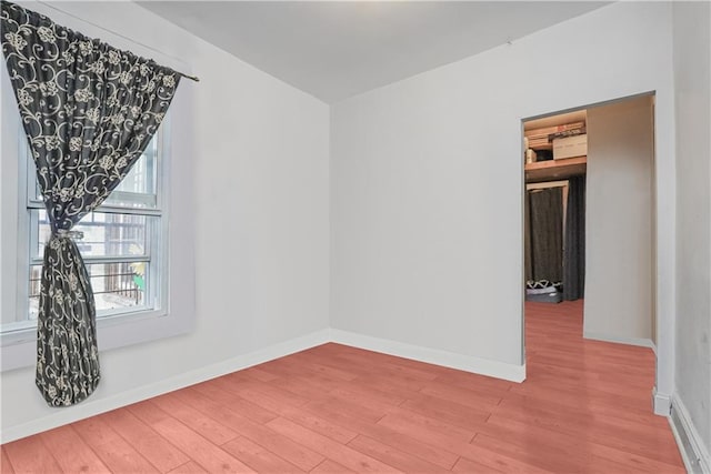 spare room featuring hardwood / wood-style floors