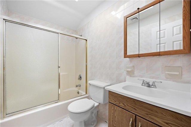 full bathroom with vanity, backsplash, combined bath / shower with glass door, toilet, and tile walls