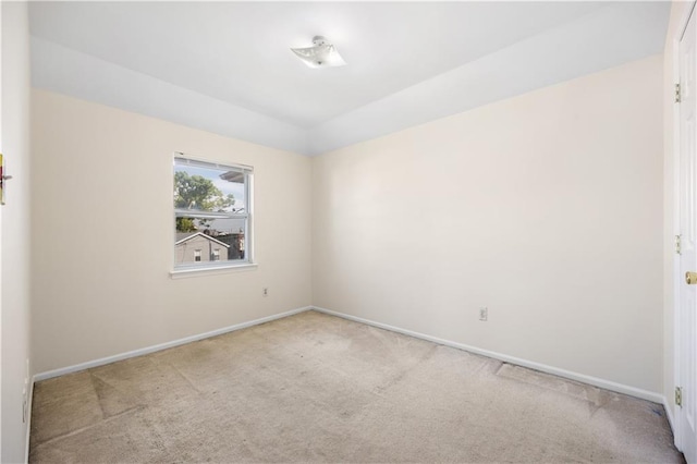 spare room with light colored carpet