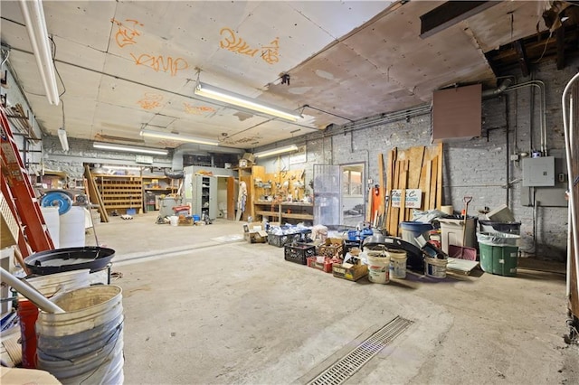 miscellaneous room with a workshop area and concrete flooring