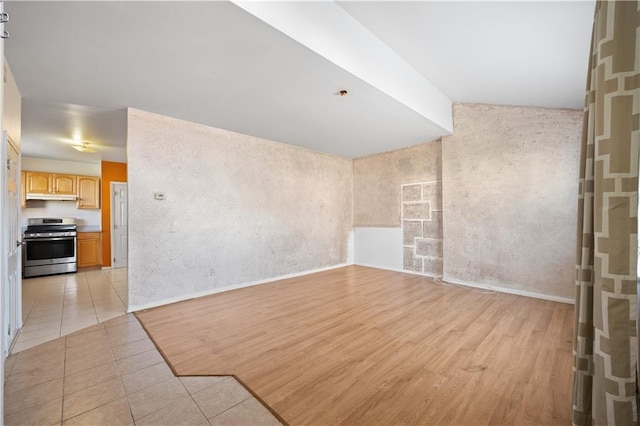 unfurnished room with light tile patterned floors