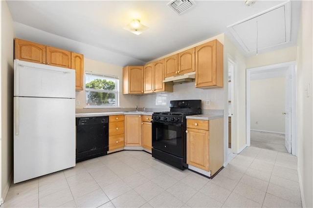 kitchen featuring decorative backsplash, light brown cabinets, sink, and black appliances