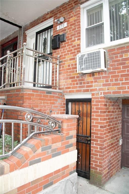 entrance to property featuring a wall mounted AC