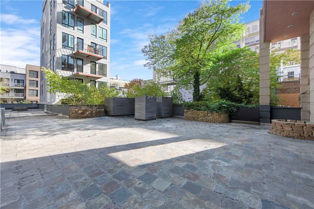 view of patio with a balcony