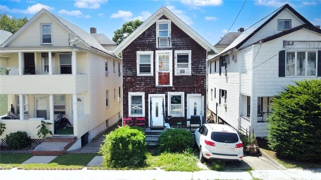 view of front of home with a balcony