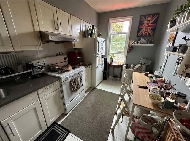 kitchen featuring white appliances and decorative backsplash