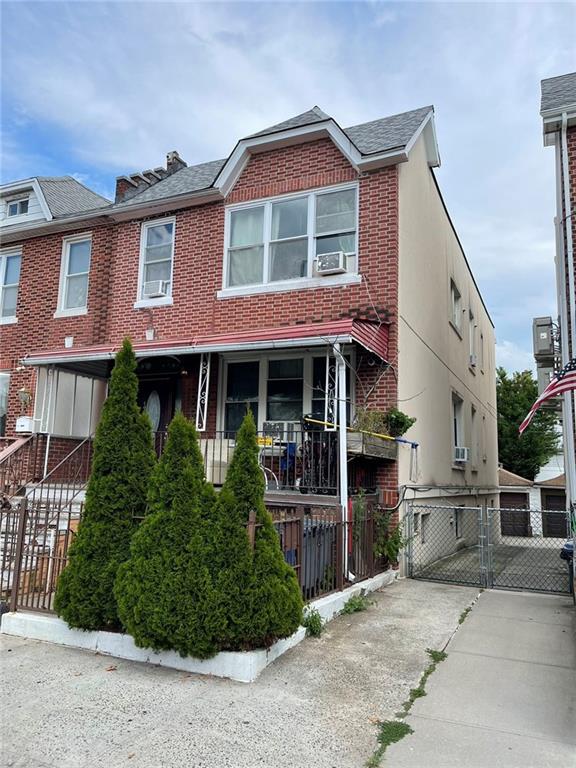 8689 15th Ave, Brooklyn, NY 11228 - multi unit property featuring fence, a gate, cooling unit, and brick siding