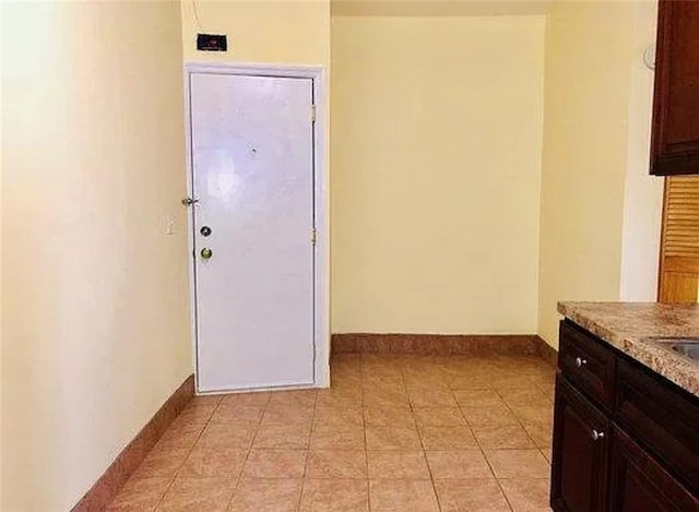 8689 15th Ave, Brooklyn, NY 11228 - hall featuring baseboards and light tile patterned floors