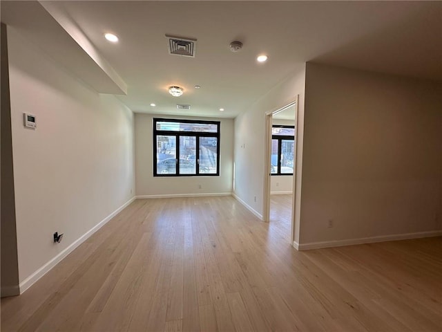 207 Bay 35th St Unit 1A, Brooklyn, NY 11214 - spare room with light wood-style flooring, recessed lighting, and a smoke detector