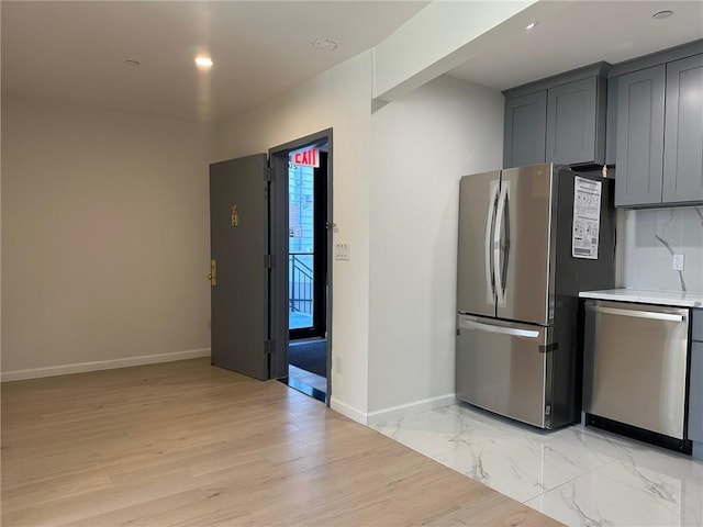 207 Bay 35th St Unit 1A, Brooklyn, NY 11214 - kitchen featuring appliances with stainless steel finishes, light countertops, light wood-type flooring, gray cabinets, and recessed lighting