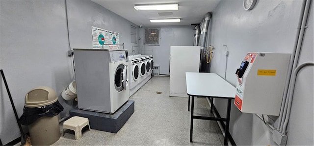 community laundry room with independent washer and dryer