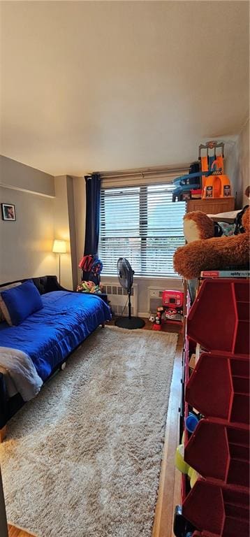 bedroom with wood finished floors