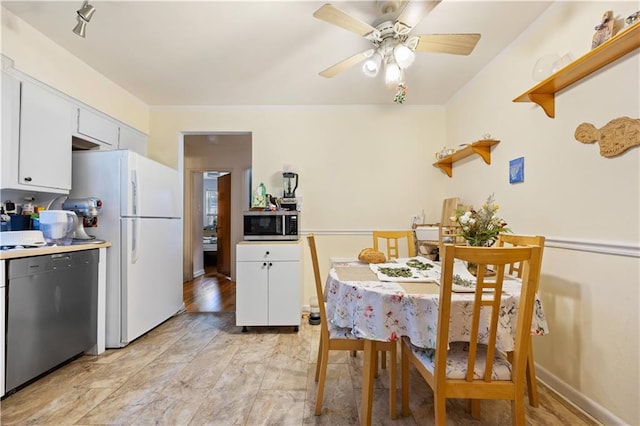 dining area featuring a ceiling fan
