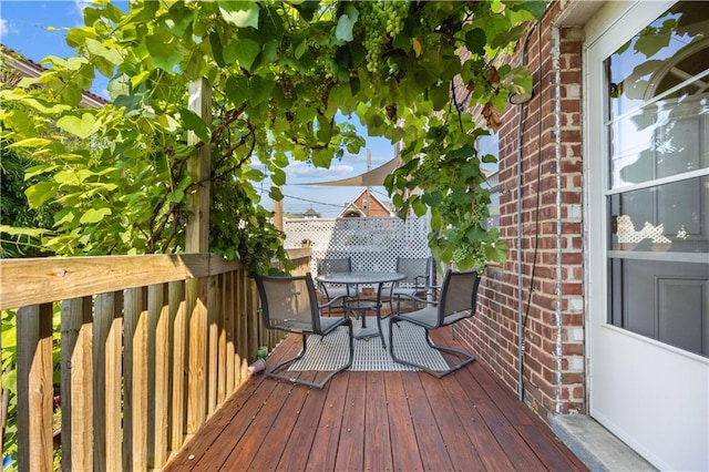 wooden deck with outdoor dining area