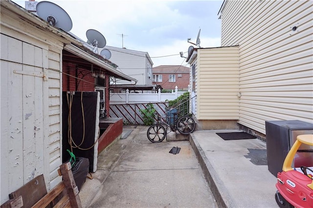 view of patio featuring fence