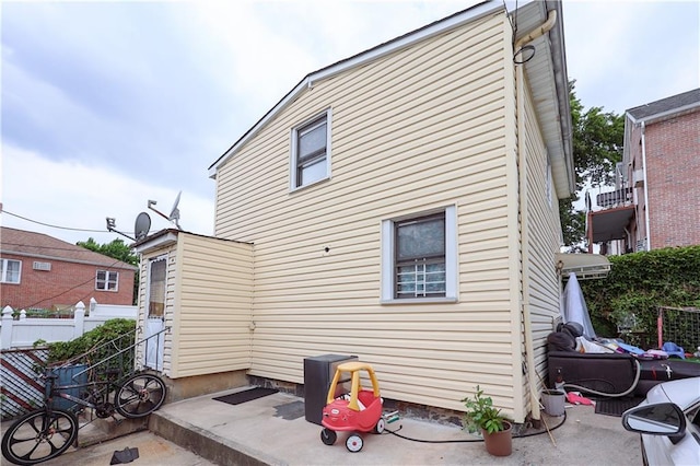 rear view of property with fence