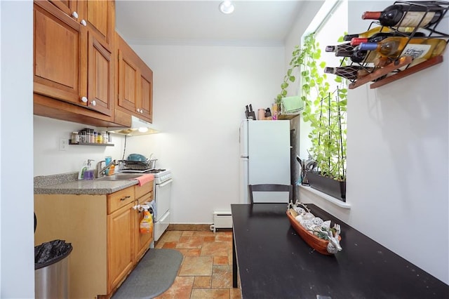 kitchen featuring stone tile flooring, white appliances, a baseboard radiator, ornamental molding, and exhaust hood