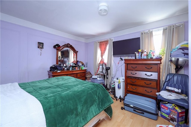bedroom with wood finished floors