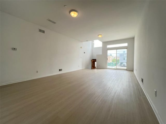 empty room with dark wood-type flooring