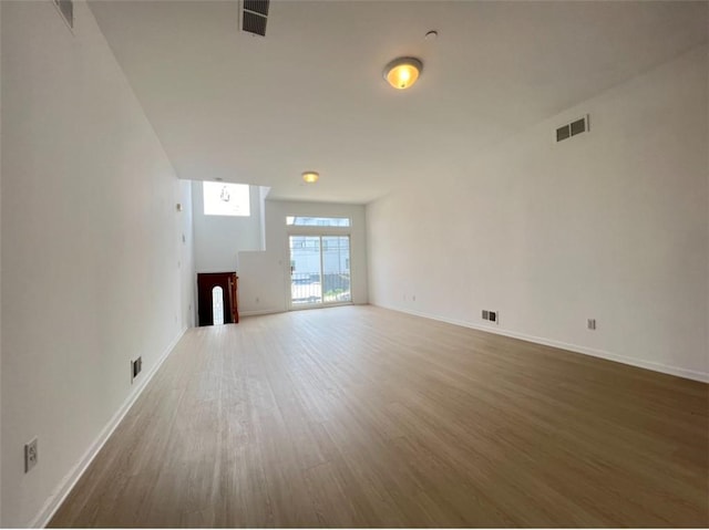 unfurnished living room with hardwood / wood-style flooring